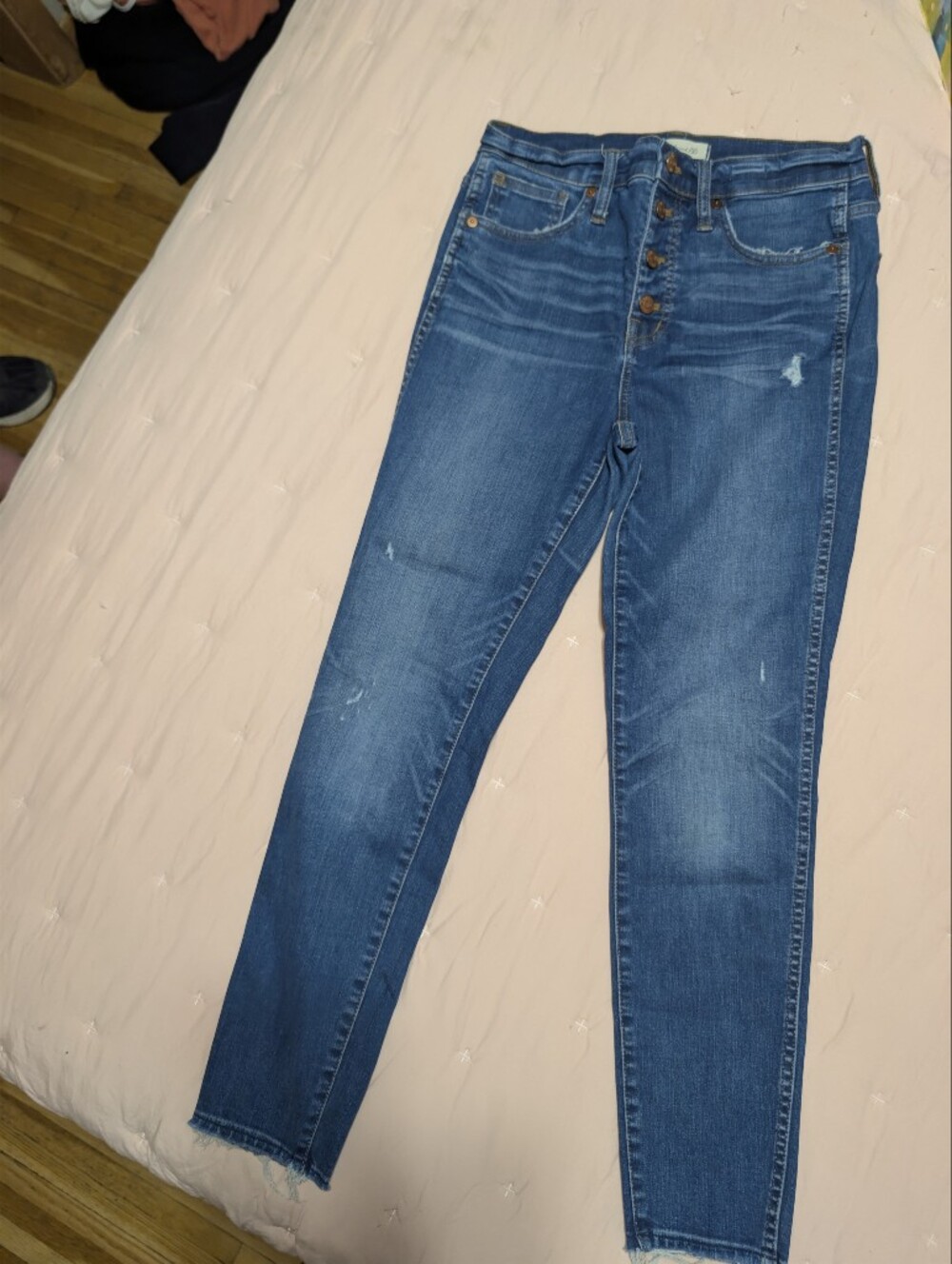 Stylish Madewell denim jeans in a medium blue wash. These high-rise skinny jeans